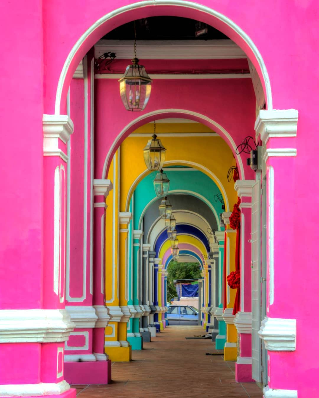 stretch of corridor with colourful pillars