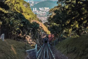 a railway track with a tunnel downwards a hill