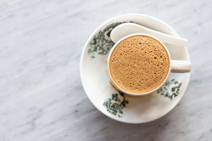 kopi served in a traditional Malaysian coffee cup