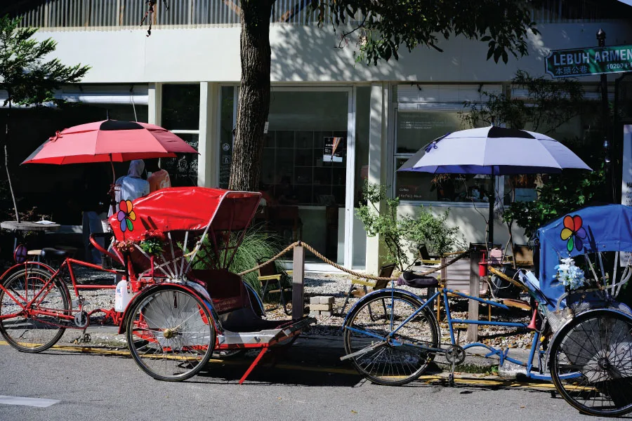 Penang trishaw lined up by the roadside