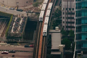 train along the tracks in a city