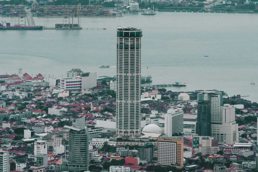 a skyscraper standing tall amongst lower buildings