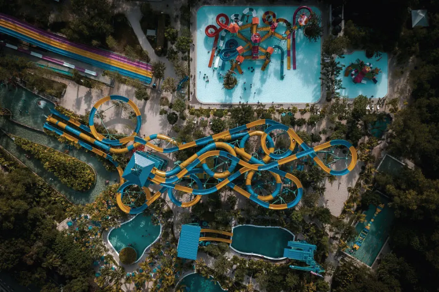 aerial view of a long water slide in a theme park