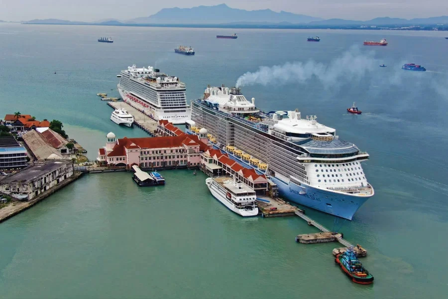 cruises and boats docking at a pier