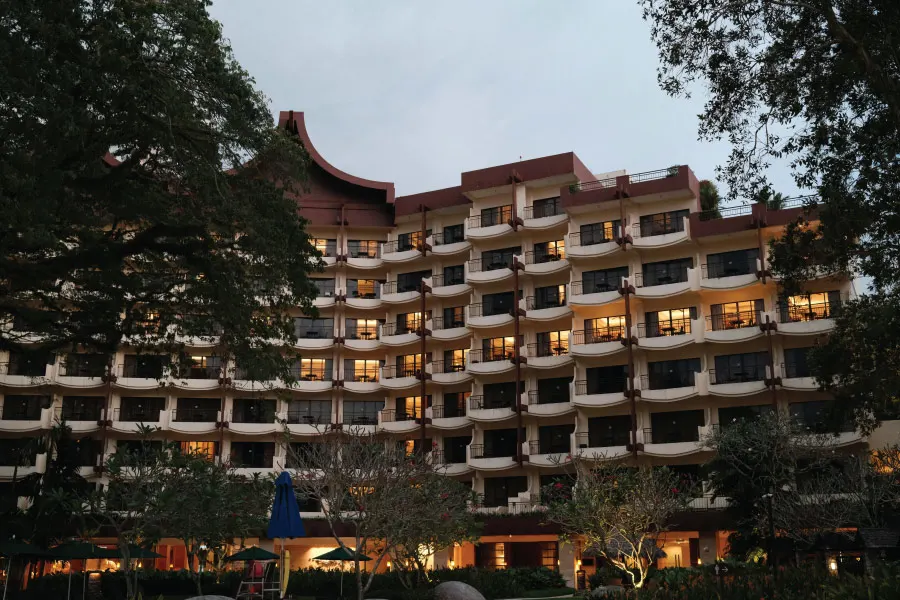 hotel building with balconies in the evening